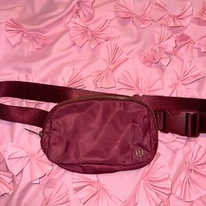 Burgundy Lululemon belt bag